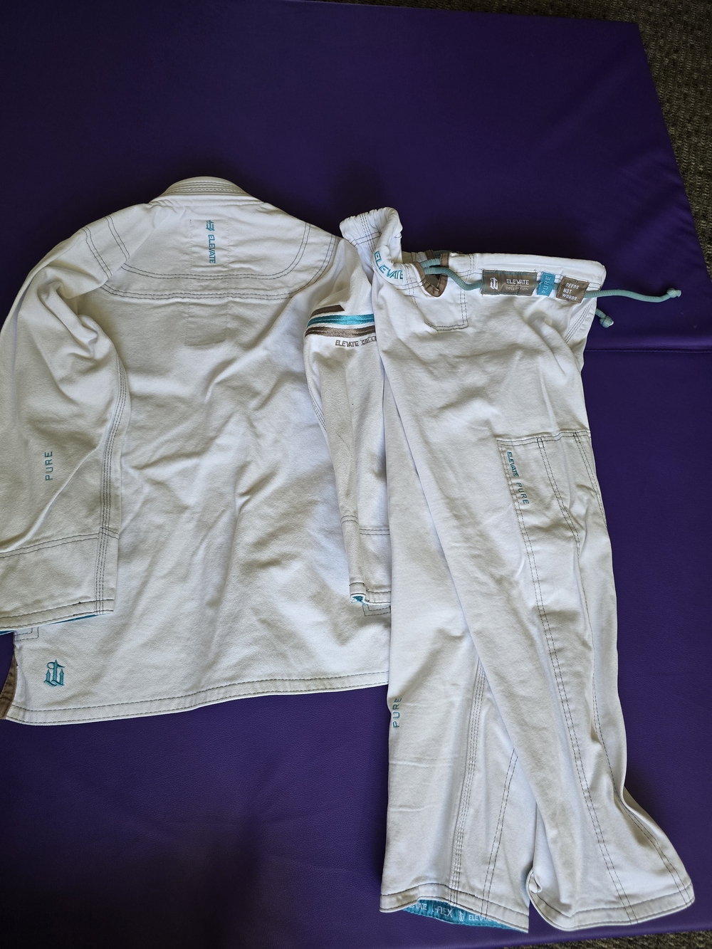 War Tribe J-Flex White Brazilian Jiu-Jitsu Gi with Teal Trim - Picture 2 of 3